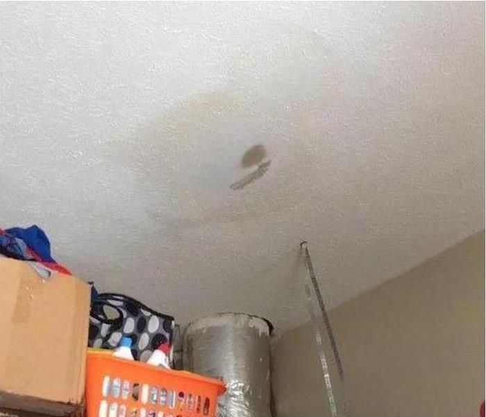 white ceiling with brown water spots