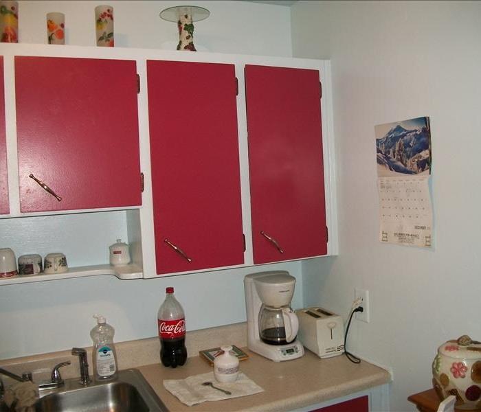 White and red kitchen cabinets in a kitchen