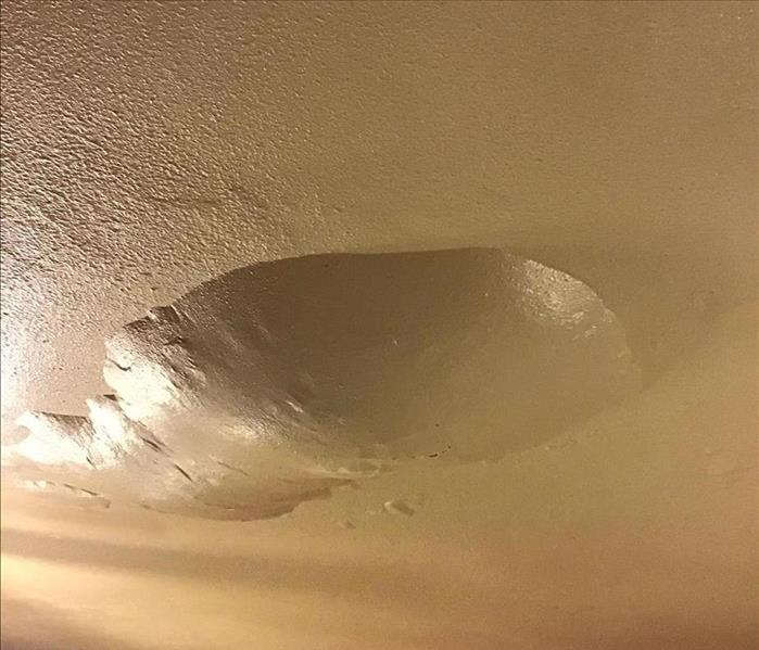 water blister on ceiling, a leak