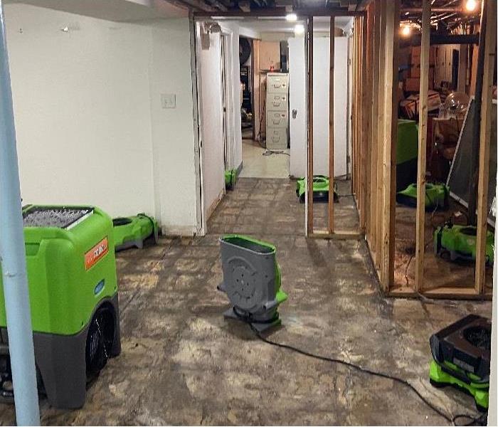 SERVPRO restoration equipment being used to dry water damaged basement