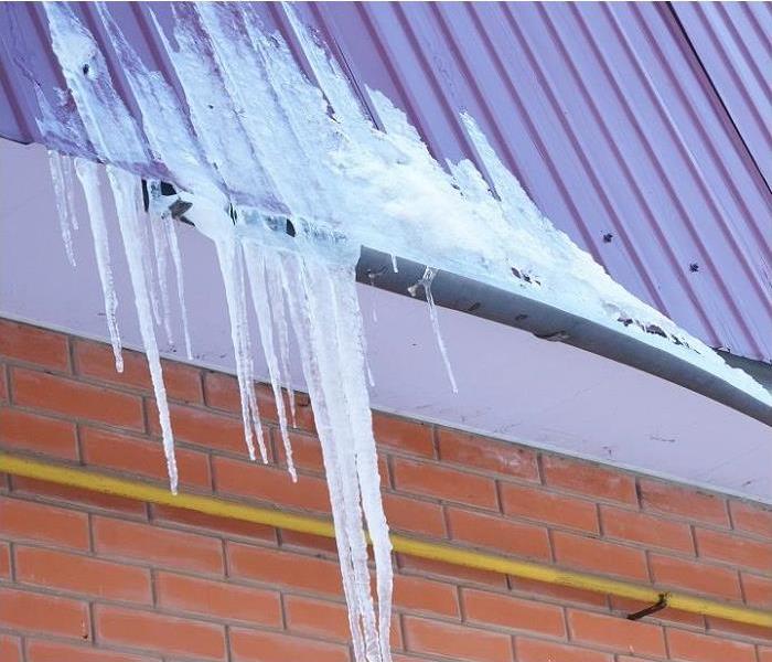 Ice in rain gutter and on roof